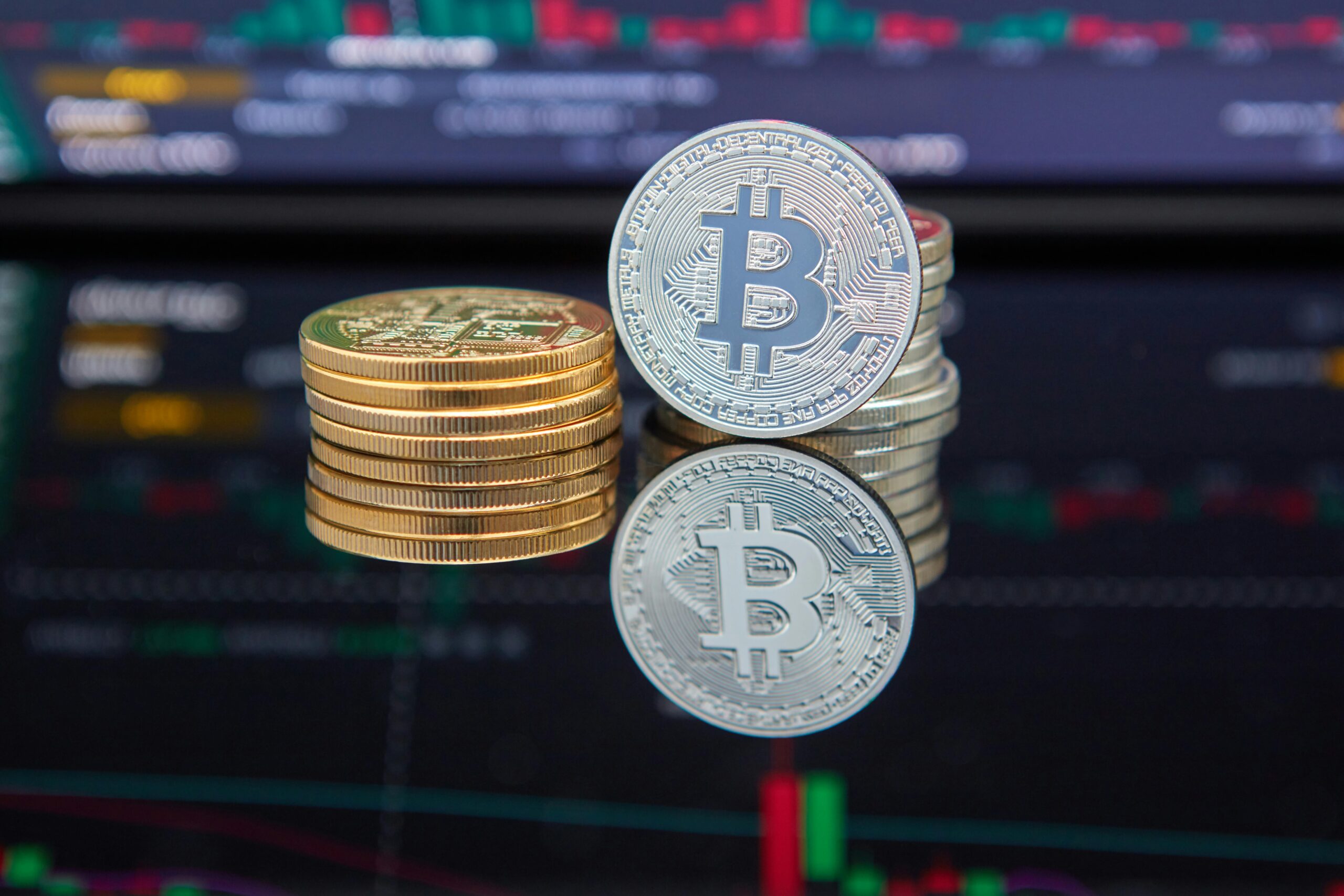Stacks of Bitcoin and Ethereum coins on a digital background, symbolizing crypto trading and derivatives expansion.