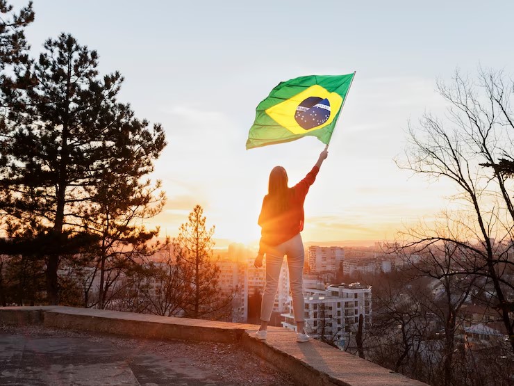 Brazilian flag waving over XRP token visuals and a gavel, symbolizing Brazil’s launch of the first spot XRP ETF following Ripple’s legal win.